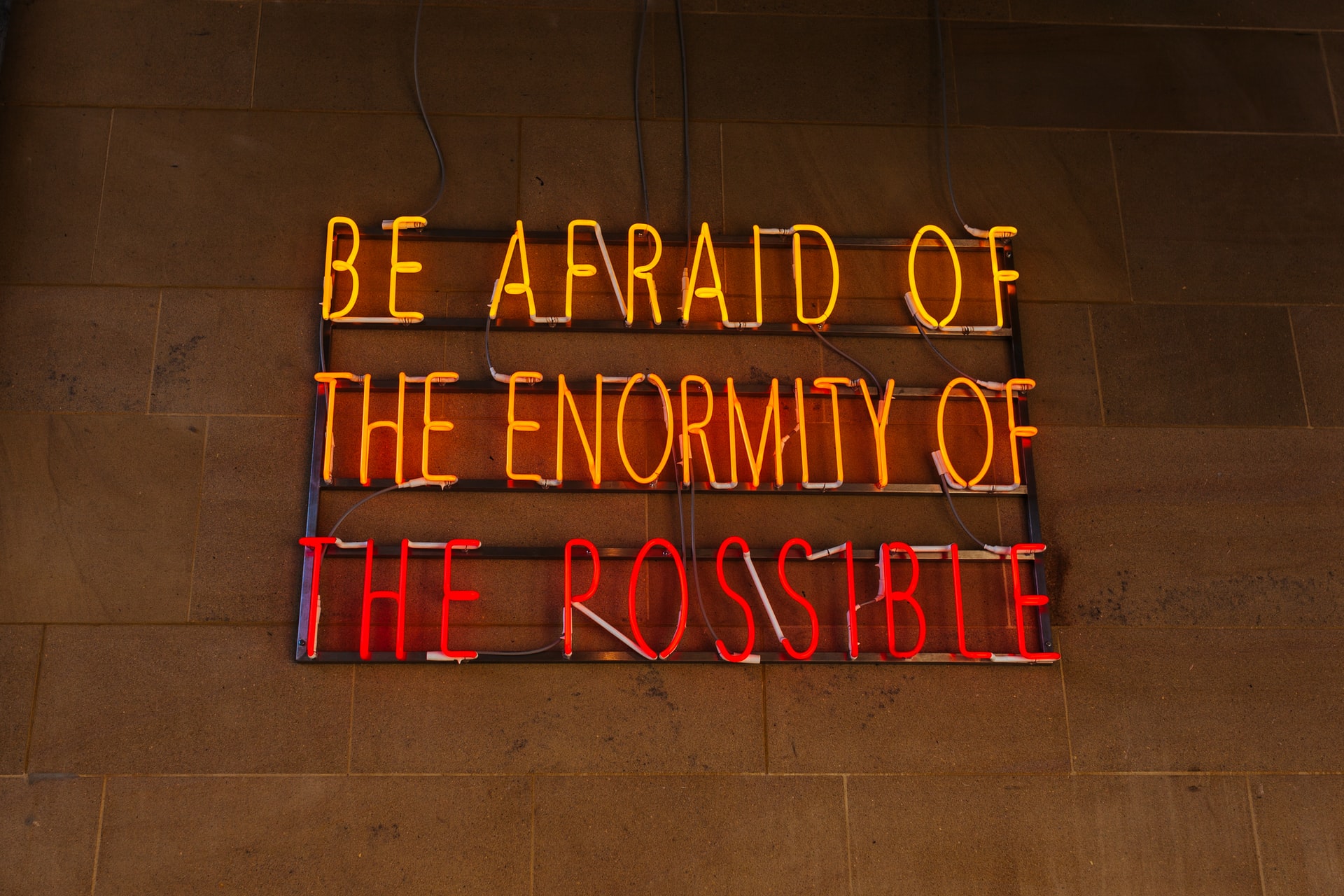 Sign that reads, "Be Afraid of the Enormity of the Possible"