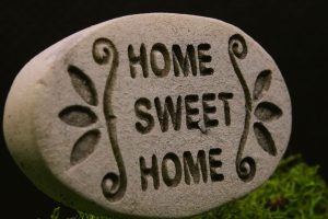 A stone with the words "Home Sweet Home" encarved