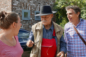 Woman speaking with locals